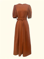 Brown dress with puff sleeves on a white background