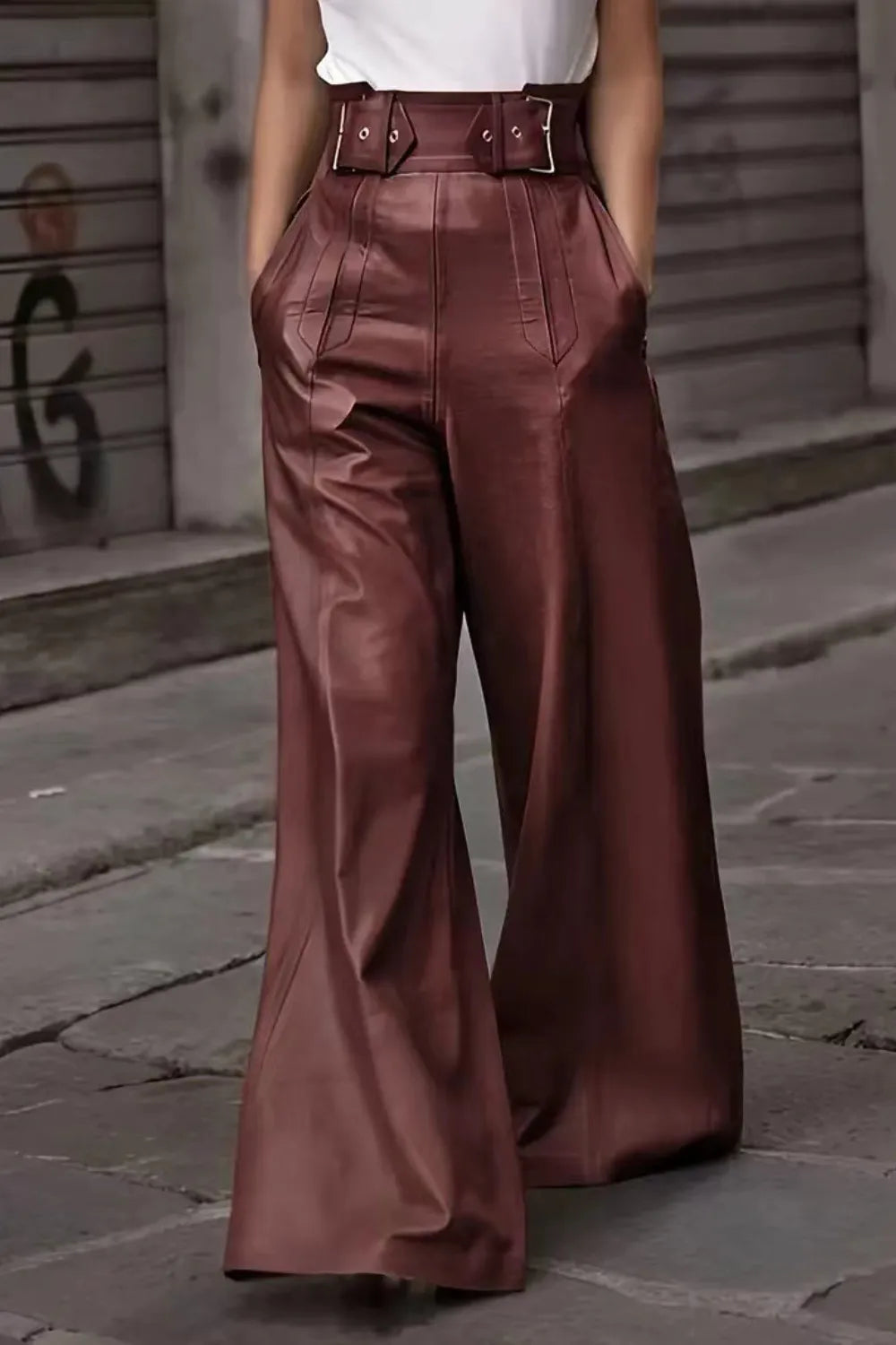 Person wearing brown wide-leg pants on a street background