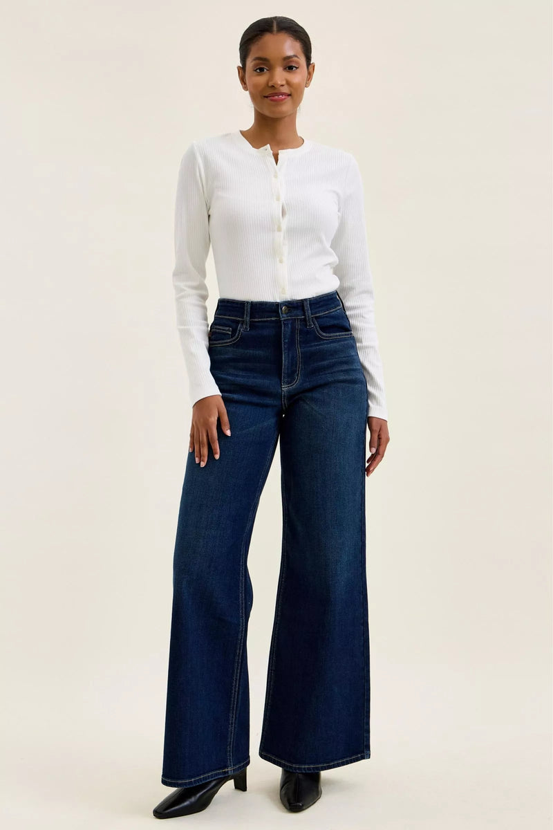 Woman showing full view of Judy Blue High-Waisted Wide-Leg Dark Wash Jeans