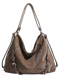 Brown leather handbag with shoulder straps on a white background