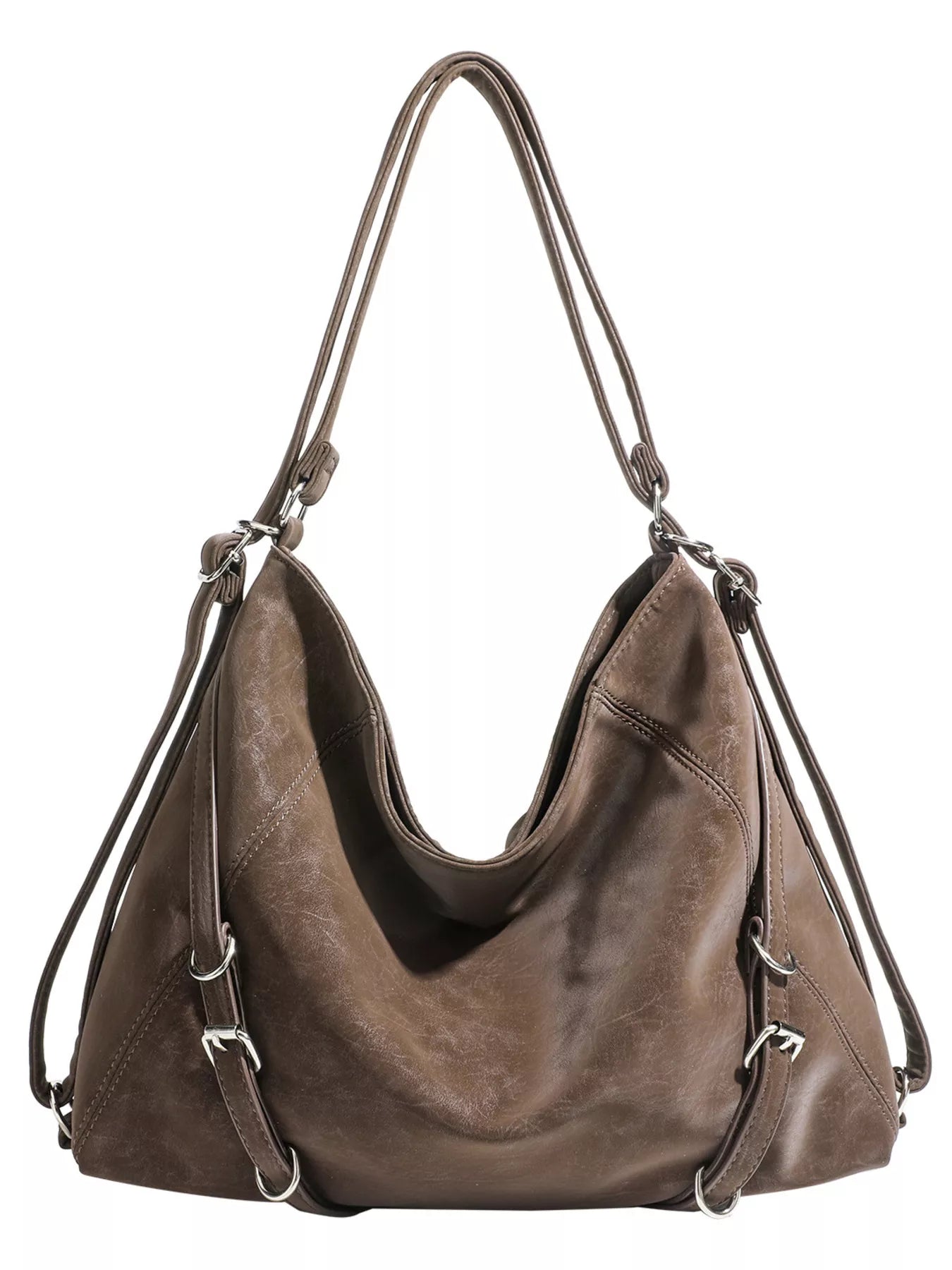 Brown leather handbag with shoulder straps on a white background