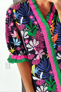 Colorful floral-patterned garment with a white wall background