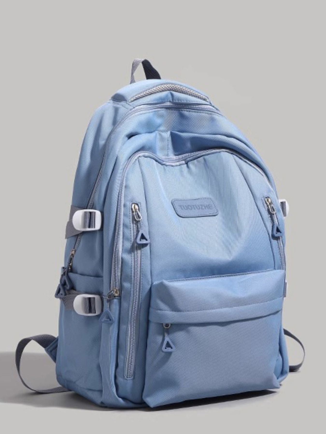 Blue backpack on a gray background