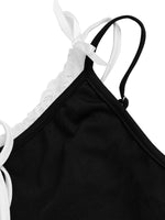 Black tank top with white lace trim on a white background