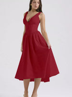 Red dress worn by a model on a white background