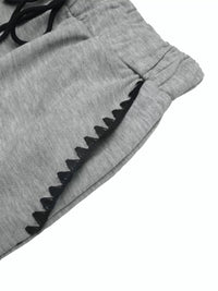 Gray pants with black trim on a white background