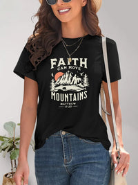 Woman wearing a black t-shirt with 'Faith Can Move Mountains' graphic and text.