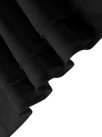 Close-up of black fabric with a textured pattern on a white background