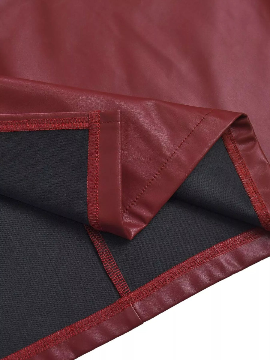 Close-up of a red and black fabric with a visible seam