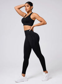 Person wearing a black athletic outfit on a white background