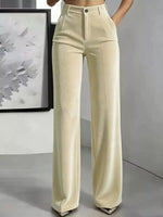 A model is wearing a pair of high-waisted, wide-leg trousers in a light cream or off-white color. The pants feature a structured waistband with belt loops, a button closure, and a straight, flowing leg.