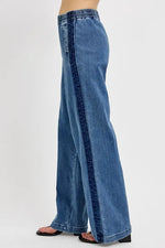 Blue wide-leg jeans on a white background
