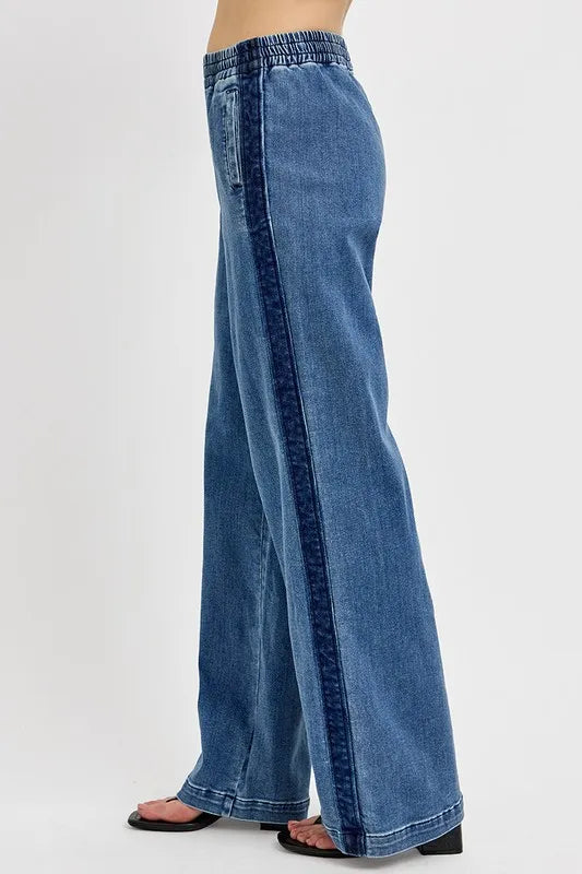 Blue wide-leg jeans on a white background