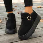 Woman showing a black pair of Round Toe Platform Boots 