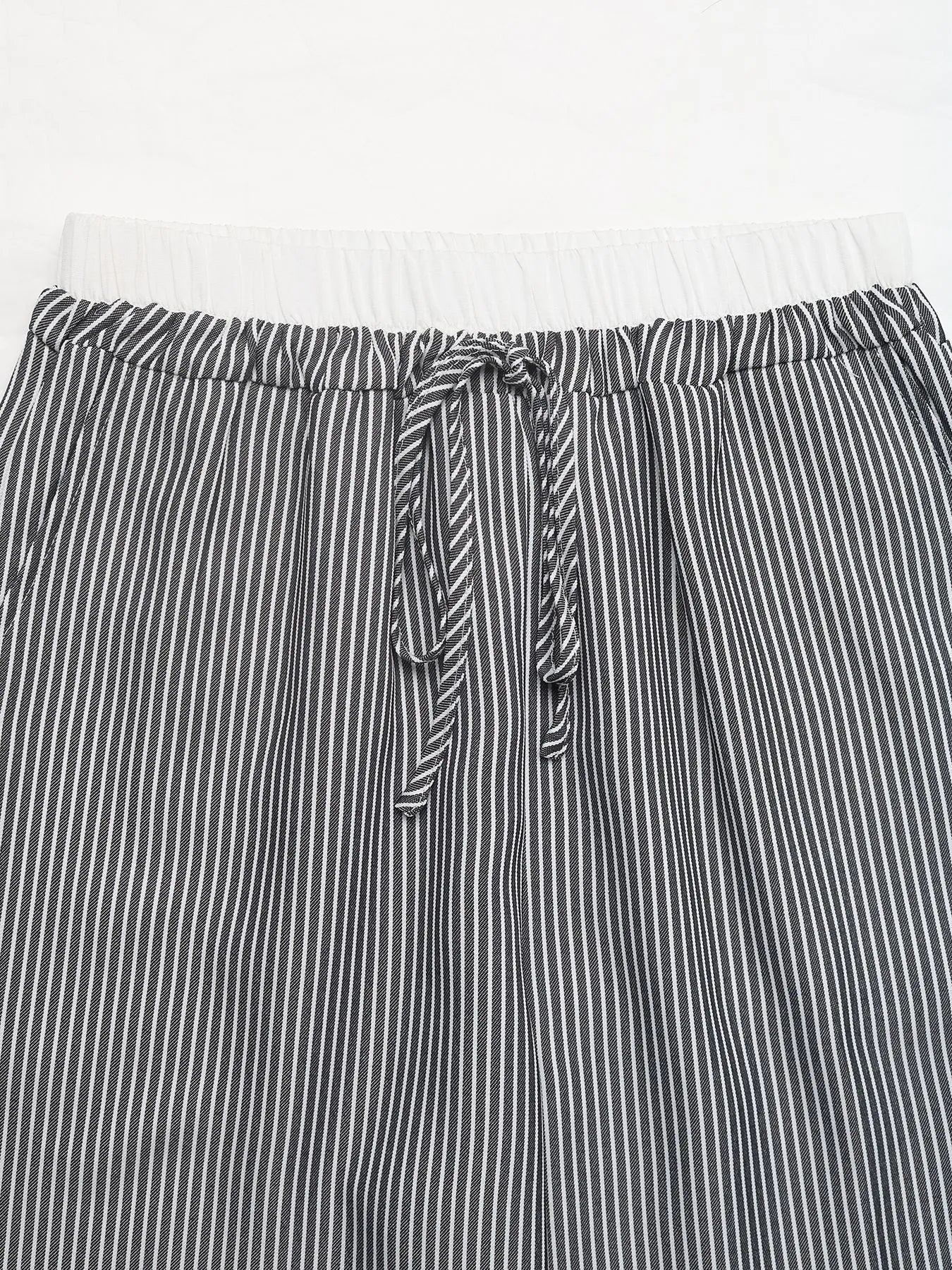 Striped pants with a tie waist on a white background