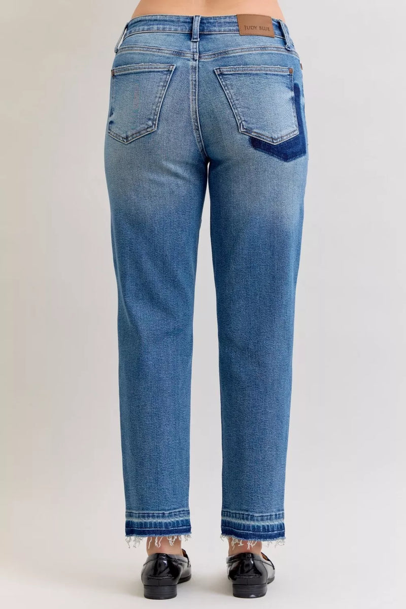 Blue jeans on a plain background
