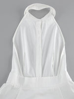 White dress with a halter neckline on a gray background