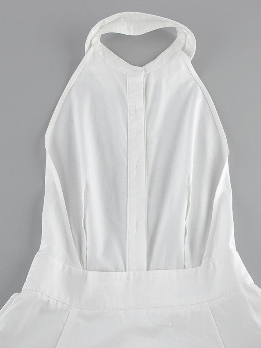 White dress with a halter neckline on a gray background