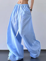 Light blue wide-leg pants worn by a person on a plain background