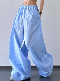 Light blue wide-leg pants worn by a person on a plain background