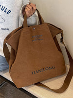 Brown bag with 'TIANELONG' branding held by a person wearing a white shirt.