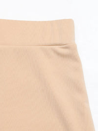 Close-up of a beige skirt on a white background