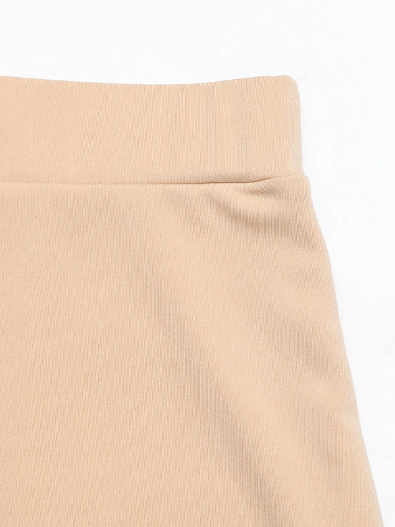 Close-up of a beige skirt on a white background