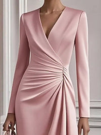 Pink dress with long sleeves on a neutral background