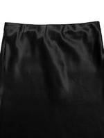 Black satin fabric with folds on a white background