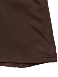 Close-up of brown fabric with a white background