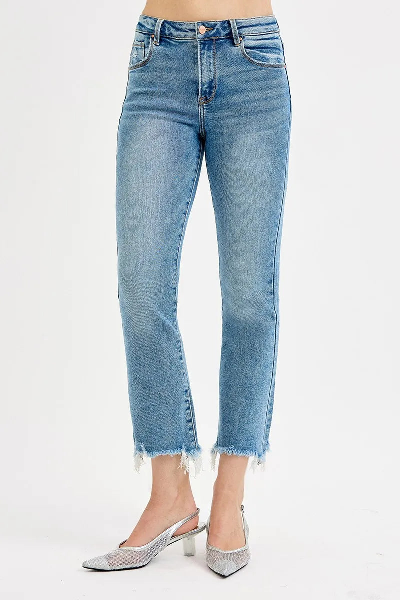 Light blue jeans worn by a person on a white background