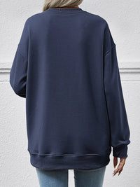 Navy blue sweatshirt worn by a person on a light gray background