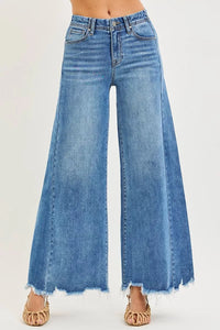 Blue wide-leg jeans on a white background
