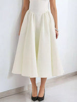 White dress with a plain background