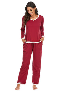 Woman wearing a red pajama set on a white background