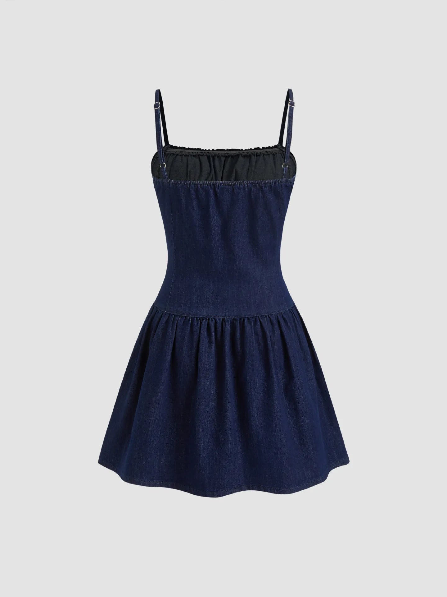 Navy blue dress with thin straps on a light gray background