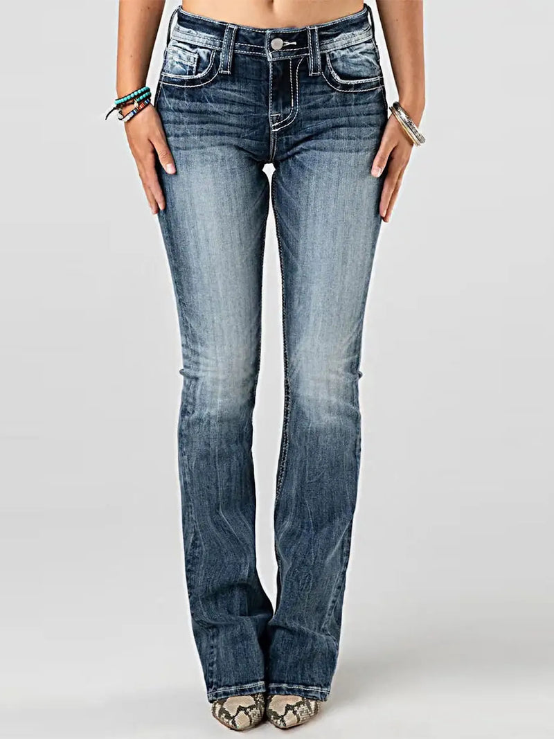 Blue jeans worn by a person on a white background