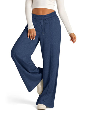 Blue wide-leg pants worn by a person on a white background
