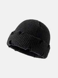 Black knit beanie on a light gray background