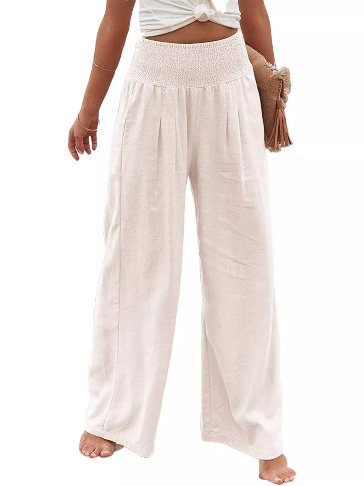 Beige wide-leg pants worn by a person on a white background