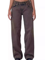 A person wearing loose-fit dark brown or charcoal-brown wide-leg jeans, shown from the waist down against a plain white background.