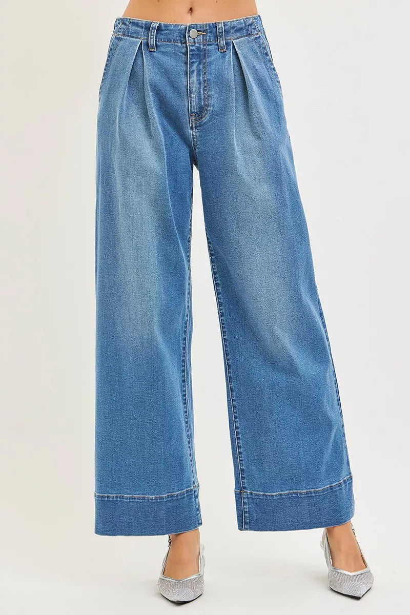 Blue wide-leg jeans on a white background