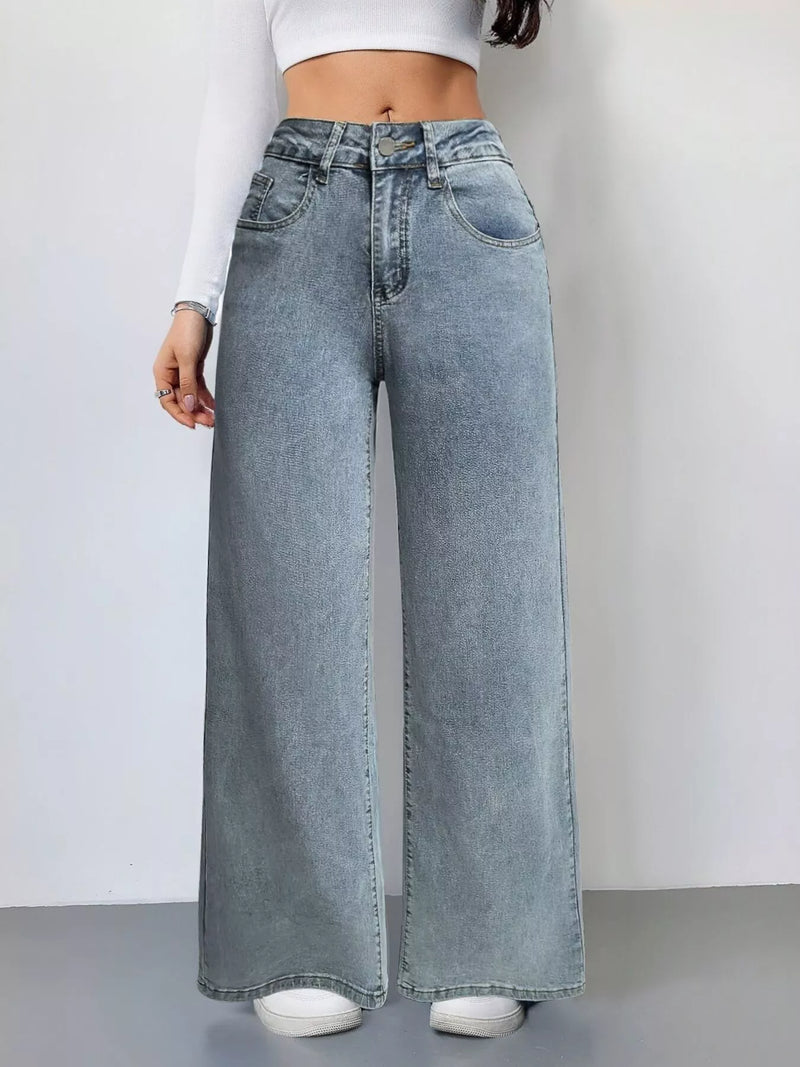 Wide-leg jeans worn by a person on a plain background