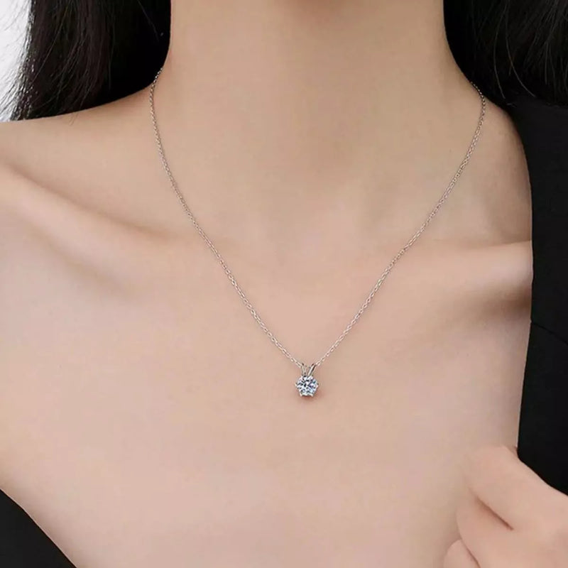 Silver necklace with a pendant on a model