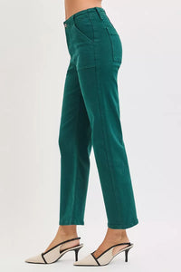 Green pants worn by a person on a white background