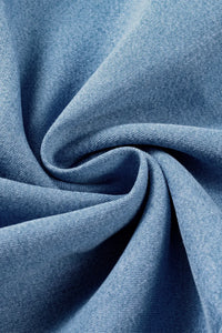 Close-up of blue fabric with folds