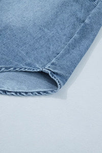 Close-up of a blue denim fabric on a light gray background