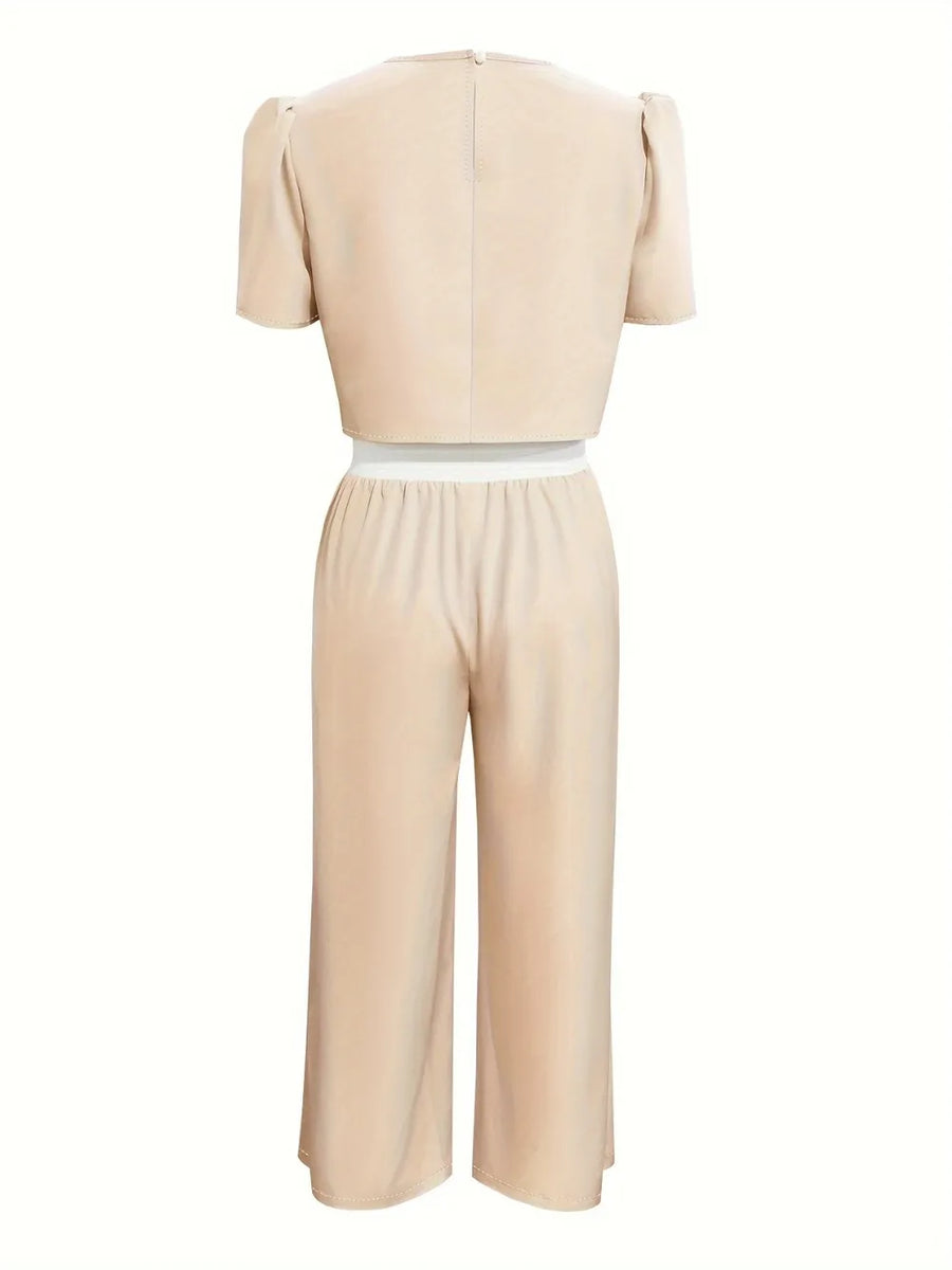 Beige jumpsuit with a white waistband on a white background