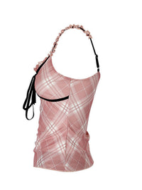 Pink plaid top with a black strap on a white background