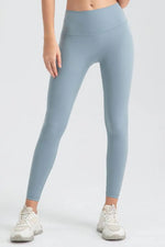Light blue leggings worn by a person on a white background
